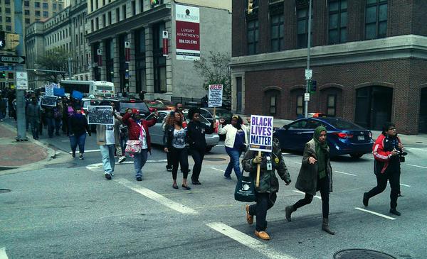 #Baltimore accompanied by sounds from sirens and helicopters in the air #FreddieGray  