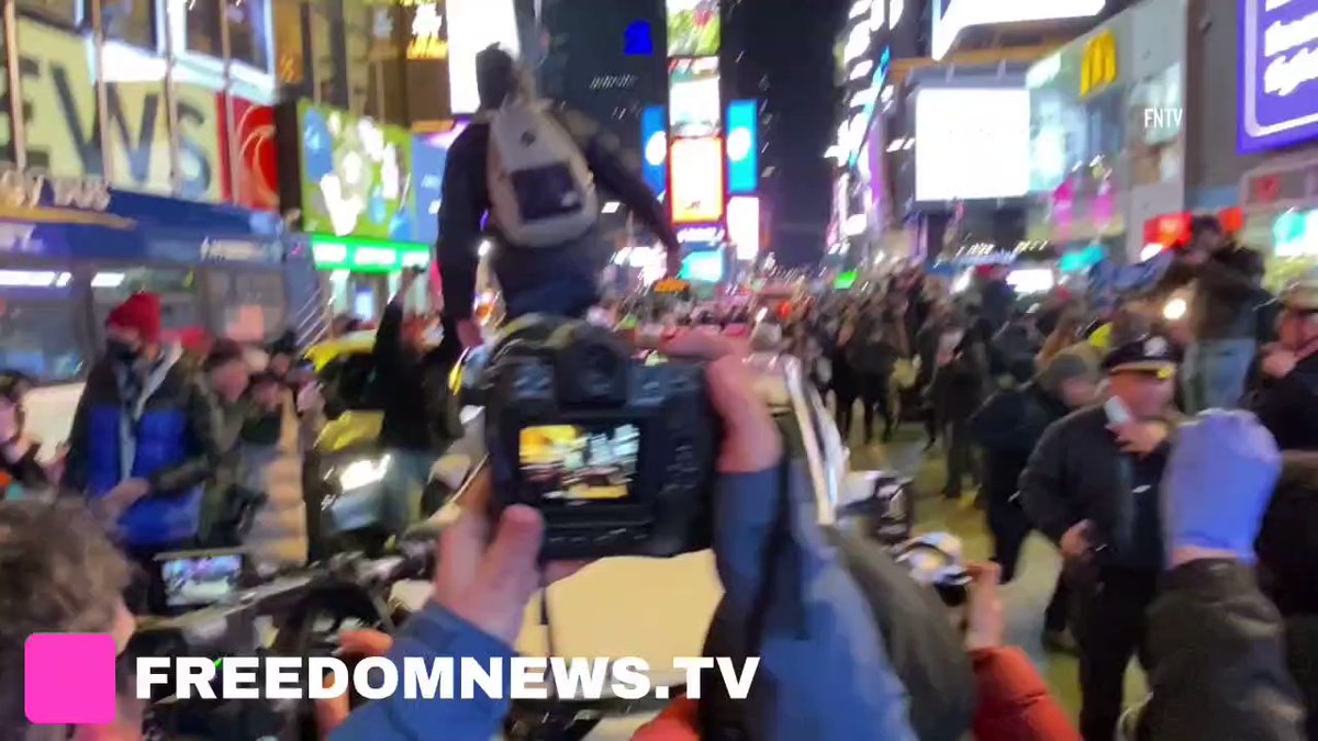 MULTIPLE ARRESTS in Times Square as a protester jumps on a cop car, smashing in window.   Protest is following TyreNicholsVideo Release in Memphis showing a brutal, deadly beating by police officers