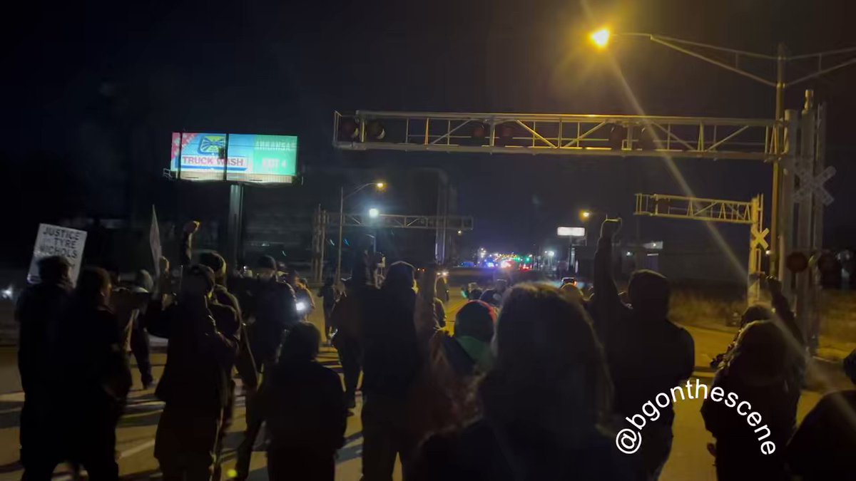 Protesters march off the freeway and back towards the streets of Memphis