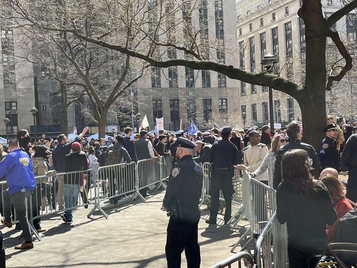 The park across from Manhattan Criminal Court is currently a circus of protestors, attention-seekers, and a tsunami of worldwide media. NYPD has set up barricades separating pro- and anti-Trump demonstrators with about a five-foot wide buffer