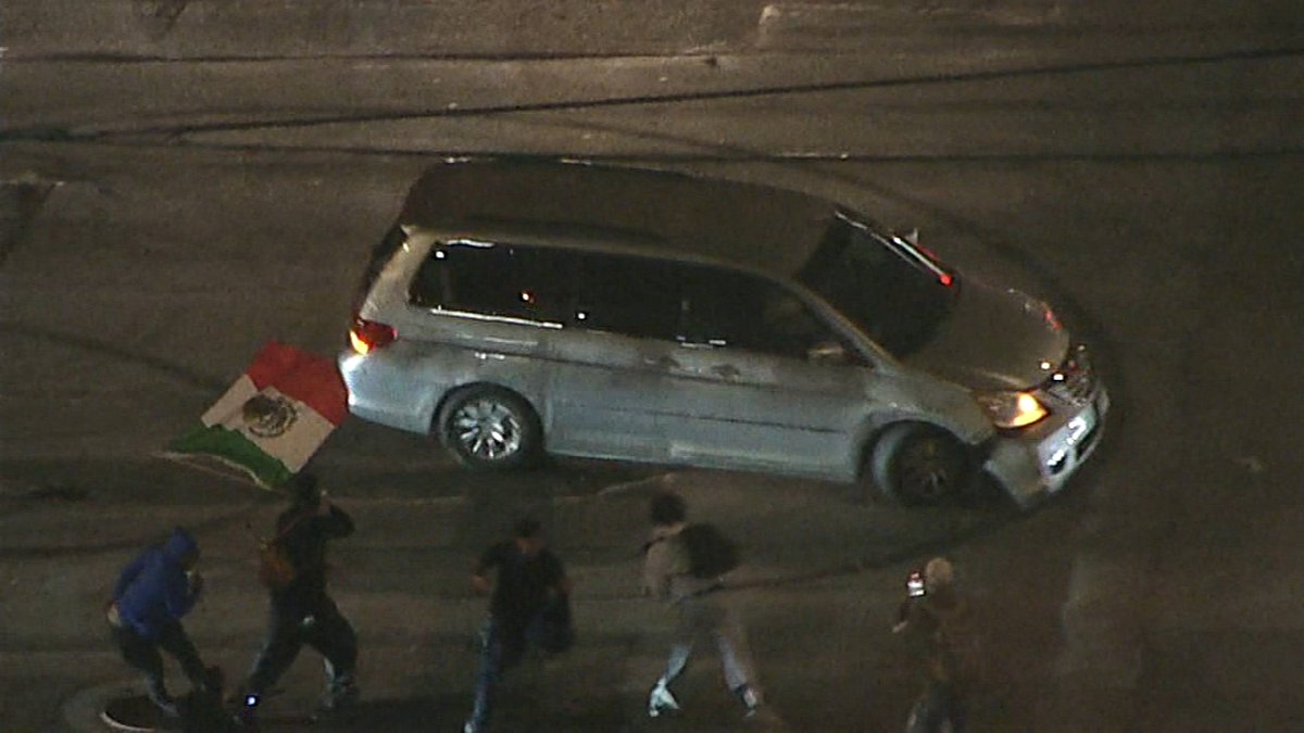 Driver in custody after doing donuts, coming dangerously close to hitting protesters in downtown LA