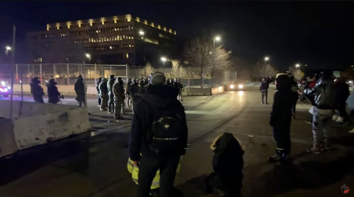 A group of around 100 protesters is clashing with officers outside the Whipple Federal Building, just east of MSP Airport, with fireworks being launched from the crowd towards officers around 9:45 p.m. including at least one that appears to have exploded directly underneath a law