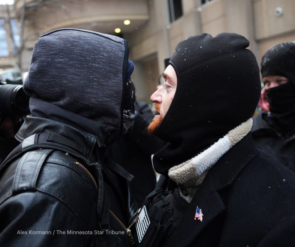 Groups from competing protests confronted each other in downtown Minneapolis Saturday as police tried to keep them separated