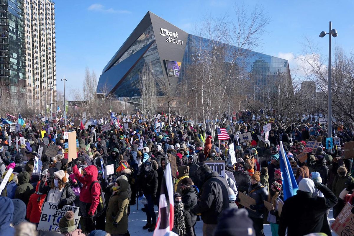 Hundreds of demonstrators streamed toward downtown Minneapolis for a march and rally against federal law enforcement, waving signs that read ICE OUT.